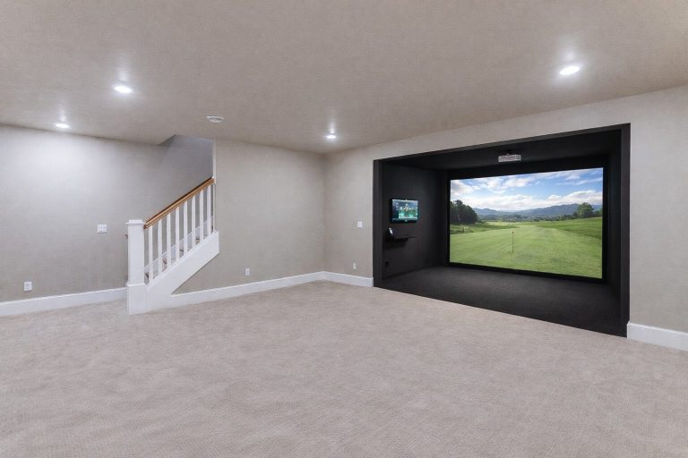 Basement golf simulator enclosure with impact screen and projector