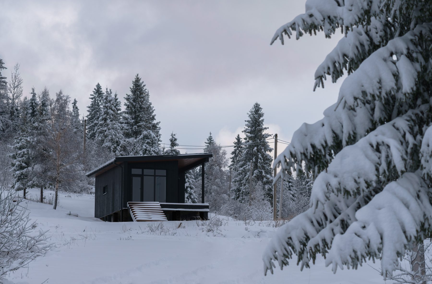 Backyard golf simulator shed in an Ontario winter